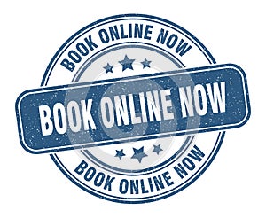 book online now stamp. book online now round grunge sign.