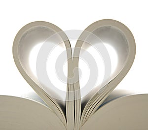 Book with opened pages and shape of heart