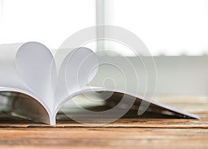 Book with opened pages of shape