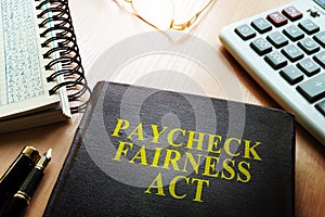 Book about Paycheck Fairness Act. photo
