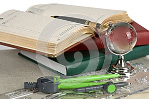 Book, pen and glass globe