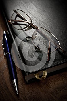 Book pen and glasses