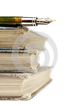 Book Pile with Fountain Pen Isolated on White