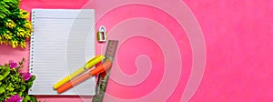 Book, ruller, sharpener and pen decorated with flowers on pink background. perfect for cover and banner concepts. copy space, flat