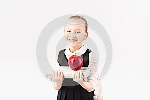 Book, school, kid. smiling little girl with big backpack holding