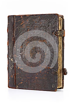 Book in a shabby leather case, studio shot.