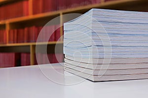 Book stack in library. Library with many shelves and books.