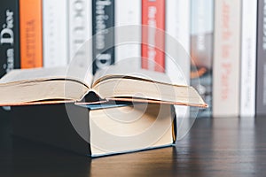 Book stack in the library room and blurred stack book for business and education background, back to school concept. Copy space