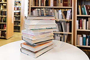Book Stack On White Desk In The Library Room photo