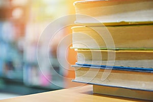 Book stacked in library - education concept back to school and business study with old books on a wooden table