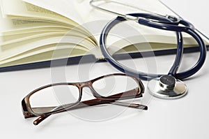 Book, Stethoscope and Glasses - Conceptual