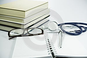 Book, Stethoscope and Glasses - Conceptual
