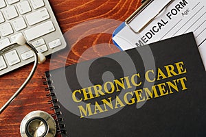 Book with title chronic care management on a table.