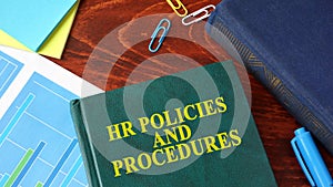 Book with title HR policies and procedures. photo