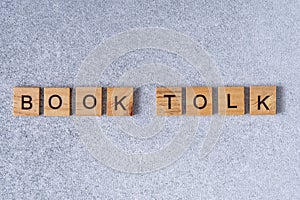Book tolk phrase made of wooden letters.
