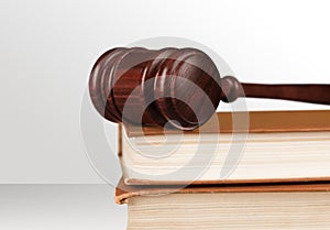 Book and wooden gavel close-up view