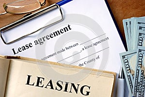 Book with word leasing, lease agreement form. photo