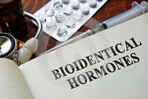 Book with words bioidentical hormones. photo