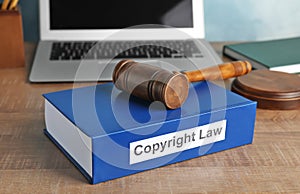 Book with words COPYRIGHT LAW and gavel