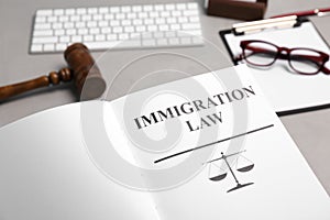Book with words IMMIGRATION LAW