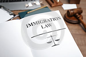 Book with words IMMIGRATION LAW