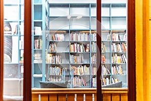 Bookcase racks in the public night library interior knowledge university