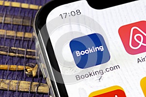 Booking.com application icon on Apple iPhone X screen close-up. Booking app icon. Booking.com. Social media app. Social network