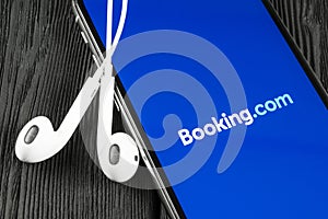 Booking.com application icon on Apple iPhone X screen close-up. Booking app icon. Booking.com. Social media app. Social network