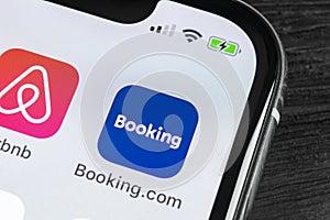 Booking.com application icon on Apple iPhone X screen close-up. Booking app icon. Booking.com. Social media app. Social network