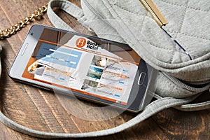 Booking hotel online,by smartphone . Travel and tourism concept.