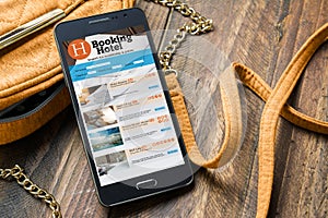 Booking hotel online,by smartphone . Travel and tourism concept.