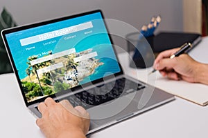 booking online concept, person using laptop computer planning travel search hotel booking