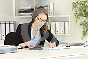 Bookkeeper doing accounting at office