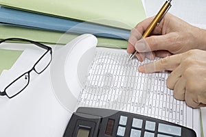 Bookkeeper or financial inspector making report, calculating or checking balance. Audit concept.