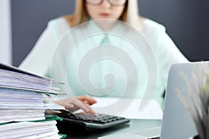 Bookkeeper or financial inspector making report, calculating or checking balance. Audit and tax service concept. Green