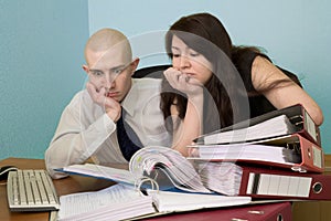 Bookkeeper and the secretary on a workplace photo