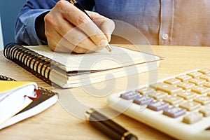 Bookkeeper writing financial report. Small business accounting.