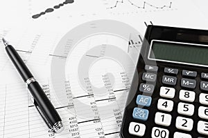 Bookkeeping and accounting business concept, calculator and pen on data sheets