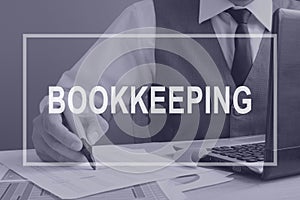 Bookkeeping. Bookkeeper working with financial report.