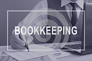 Bookkeeping. Bookkeeper working with financial report. photo