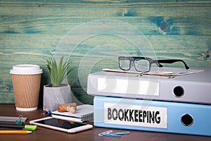 Bookkeeping concept. Binders on desk in the office. Business background