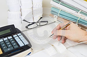 Bookkeeping files and tools with eyeglasses. Audit concept