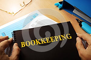 Bookkeeping written on a note. photo