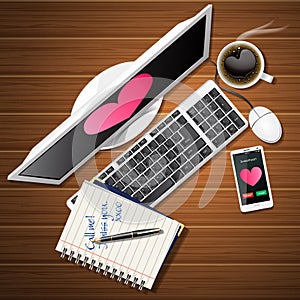 Booklet and computer with mobile phone and coffee cup