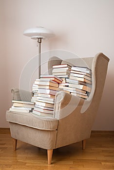 Books on an armchair in reading room