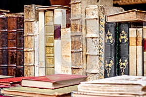 Books background. Old books in a row. Antique books.