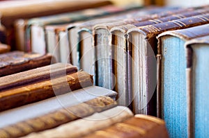 Books background. Old leather covered books