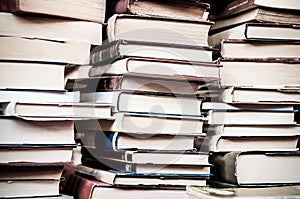 Books background. Piles of old used books