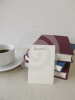 Books, booklist and cup of coffee