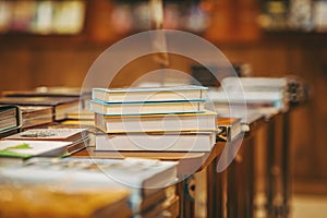 Books in bookstore. Books for sale on table, selective focus. Concept of literature and education